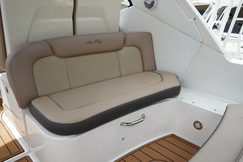 Slide: The Image of 2016 Sea Ray 330 Sundancer interior seating with beige and brown upholstery. - 8