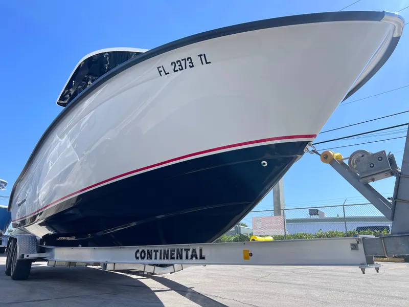 Slide: The Image of 2022 Cape Horn 24 XS boat on Continental trailer, viewed from front angle. - 10