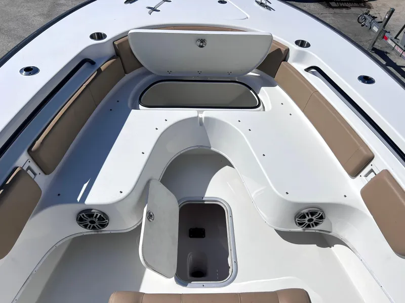 Slide: The Image of 2022 Cape Horn 24 XS boat interior with seating and storage compartments. - 16