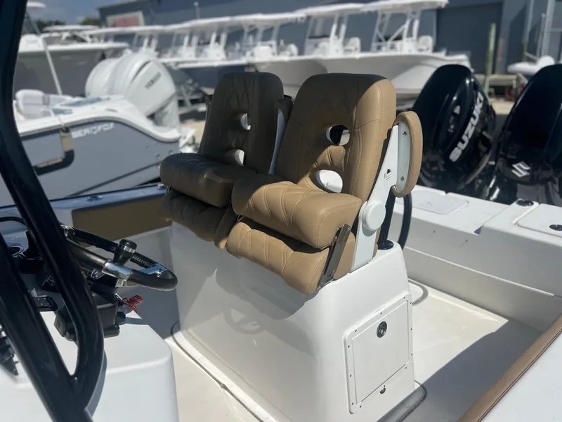 Slide: The Image of 2022 Cape Horn 24 XS boat with tan seats and modern console design. - 28