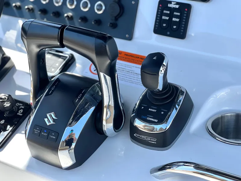Slide: The Image of Control panel of 2022 Cape Horn 24 XS boat with Suzuki throttle and joystick. - 36