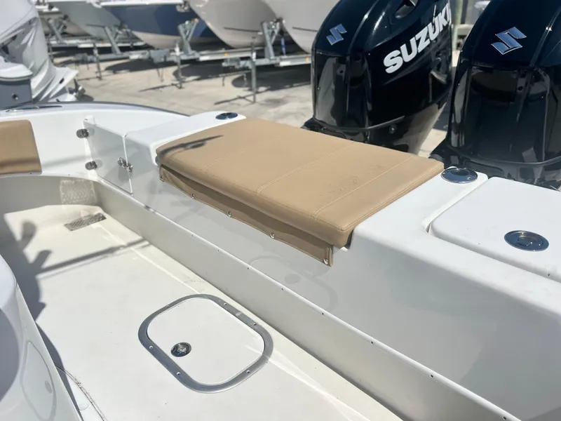 Slide: The Image of 2022 Cape Horn 24 XS boat interior with seating and Suzuki engines. - 43