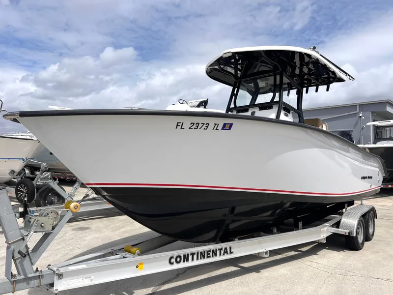 Slide: The Image of 2022 Cape Horn 24 XS boat on trailer, side view, cloudy sky background. - 12