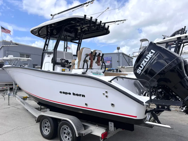 Slide: The Image of 2022 Cape Horn 24 XS boat with Suzuki engine on trailer, outdoor display. - 2