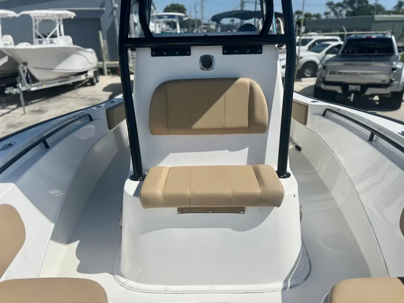 Slide: The Image of 2022 Cape Horn 24 XS boat interior with tan seating and sleek design. - 21