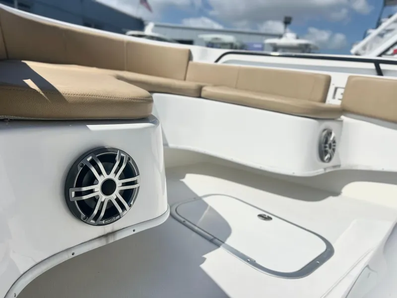 Slide: The Image of 2022 Cape Horn 24 XS boat interior with cushioned seating and speakers. - 22