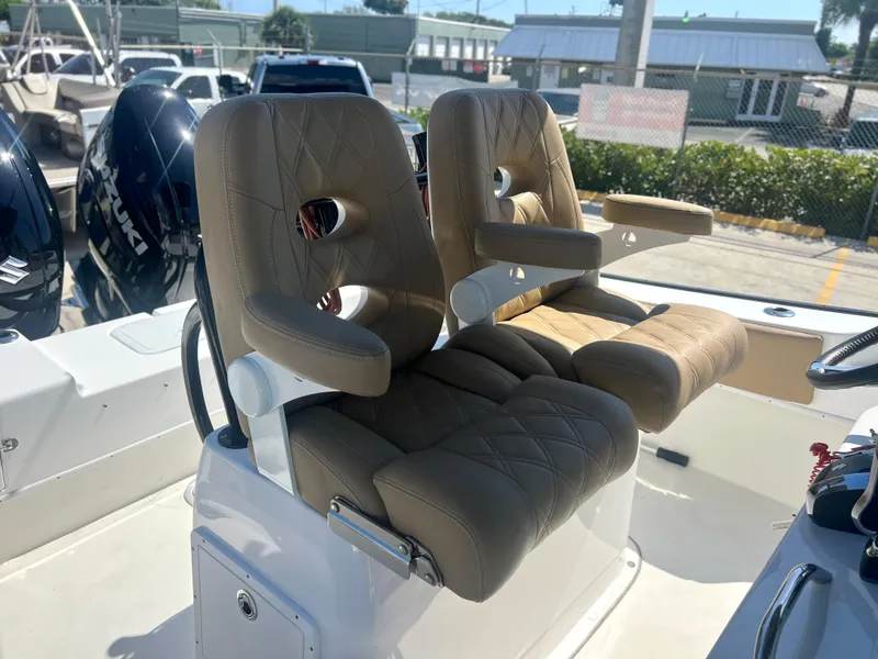 Slide: The Image of 2022 Cape Horn 24 XS boat with dual cushioned seats and modern design. - 31