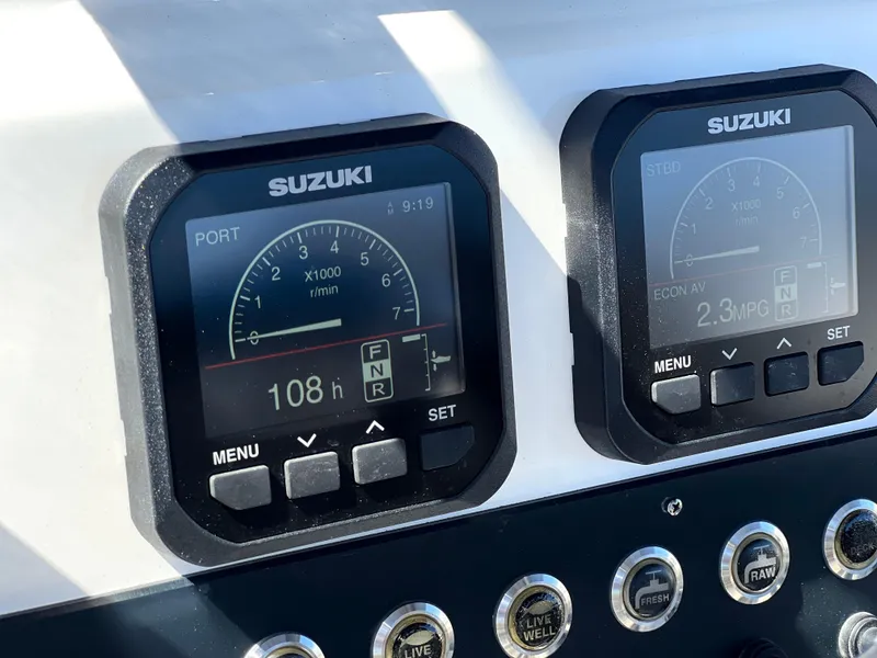 Slide: The Image of 2022 Cape Horn 24 XS boat dashboard with Suzuki engine displays showing RPM and fuel efficiency. - 38