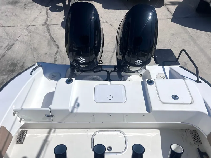 Slide: The Image of 2022 Cape Horn 24 XS boat with dual outboard engines, viewed from the rear deck. - 40