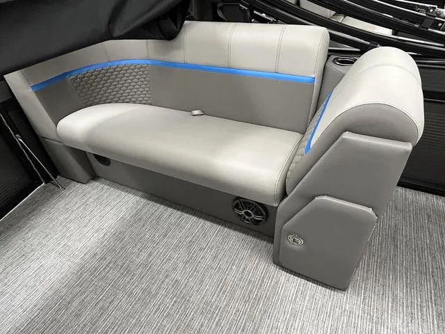 Slide: The Image of Gray seating in 2023 Qwest 822 RLS boat, featuring blue accents and textured upholstery. - 10