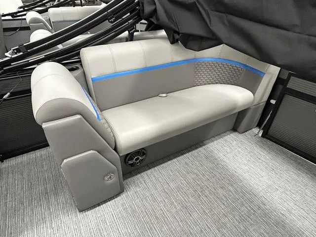 Slide: The Image of 2023 Qwest 822 RLS boat interior with gray seating and blue accents. - 11