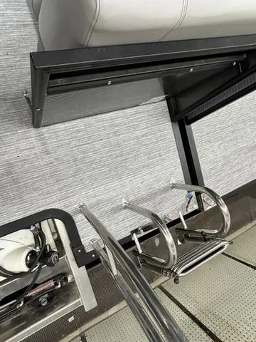 Slide: The Image of 2023 Qwest 822 RLS boat interior with metal ladder and seating. - 13