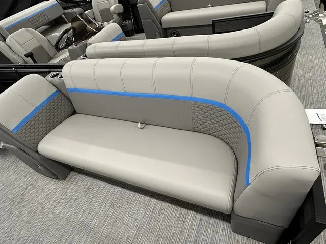 Slide: The Image of Luxurious seating in a 2023 Qwest 822 RLS boat, featuring gray upholstery with blue accents. - 3