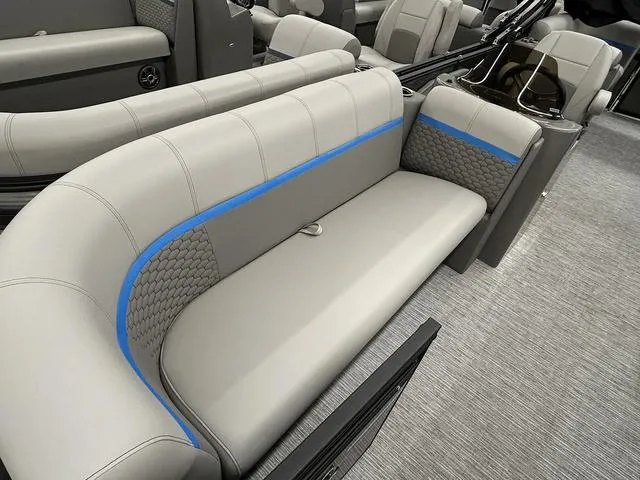 Slide: The Image of Luxurious seating in 2023 Qwest 822 RLS boat, featuring gray upholstery with blue accents. - 4