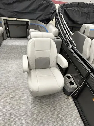 Slide: The Image of 2023 Qwest 822 RLS boat interior with gray seating and cup holders. - 7
