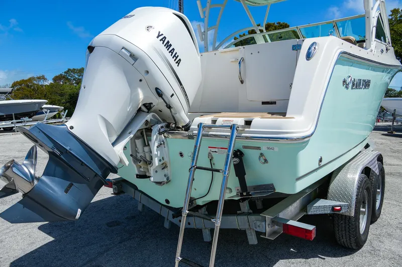 Slide: The Image of 2019 Sailfish 245 DC boat with Yamaha outboard motor on trailer. - 7