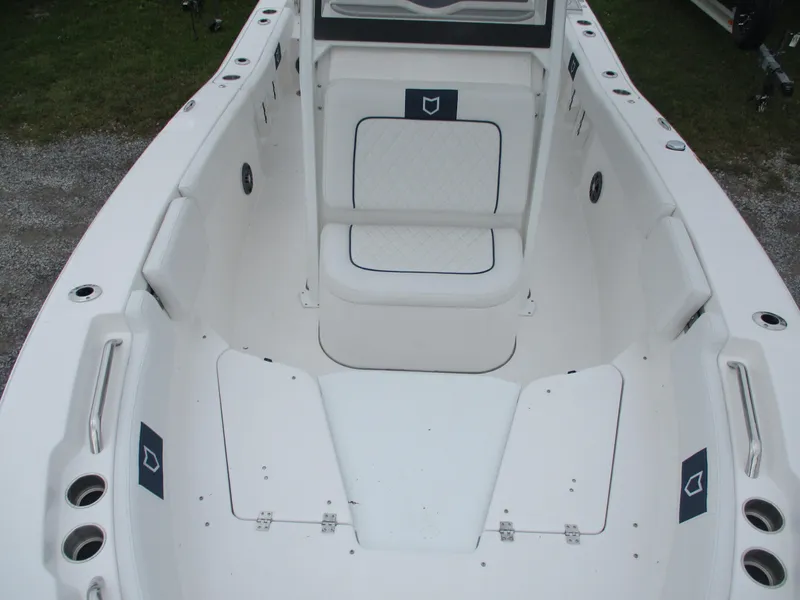 Slide: The Image of 2025 Sea Fox 228 Commander boat interior with white seating and storage compartments. - 10