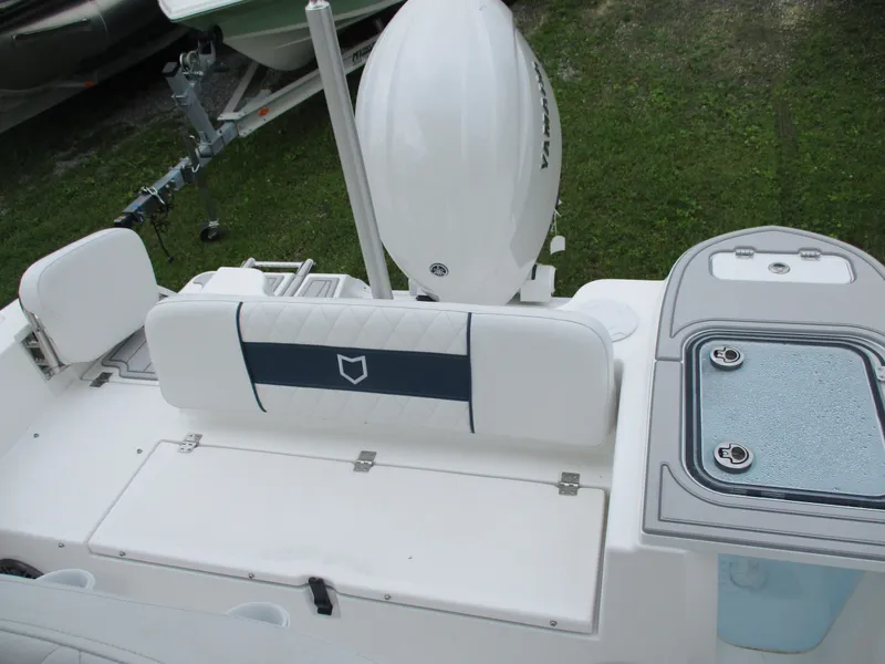 Slide: The Image of 2025 Sea Fox 228 Commander boat interior with seating and storage compartments. - 12