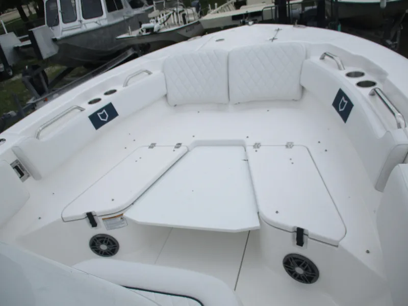 Slide: The Image of 2025 Sea Fox 228 Commander boat interior with white seating and cup holders. - 8