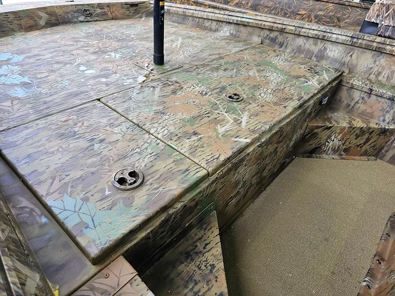 Slide: The Image of 2025 G3 Gator Tough 17 CC boat with camouflage deck and seating area. - 12