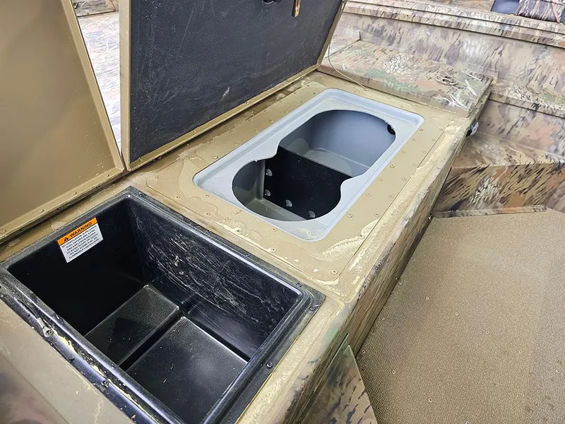 Slide: The Image of Open storage compartments on a 2025 G3 Gator Tough 17 CC boat. - 13