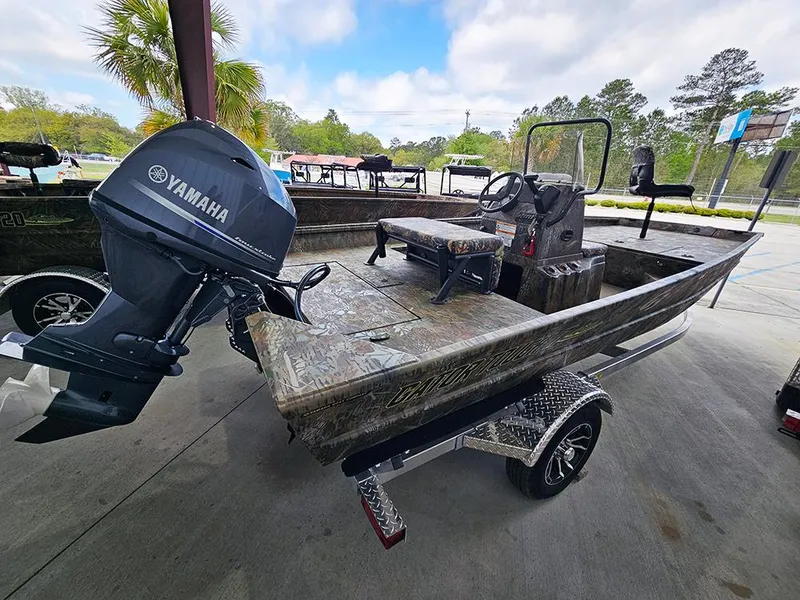 Slide: The Image of 2025 G3 Gator Tough 17 CC boat with Yamaha motor, parked outdoors. - 3
