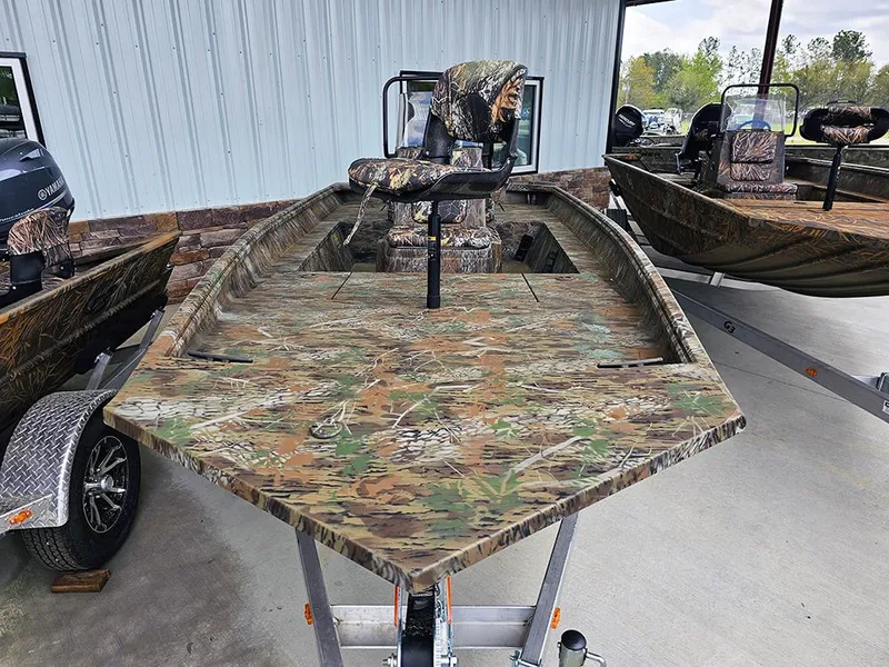 Slide: The Image of 2025 G3 Gator Tough 17 CC boat with camouflage design on a trailer. - 4