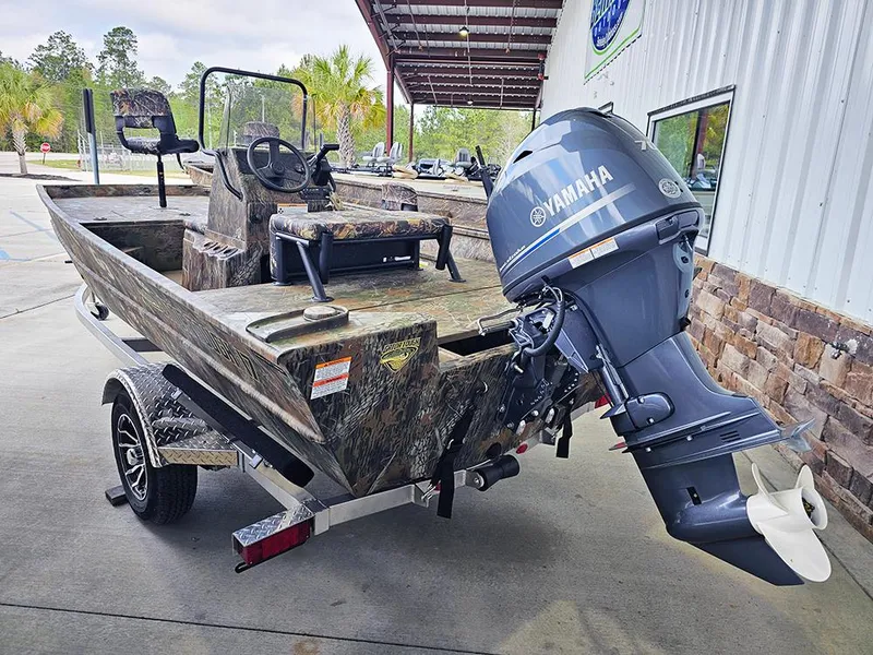 Slide: The Image of 2025 G3 Gator Tough 17 CC boat with Yamaha outboard motor, parked outdoors. - 5
