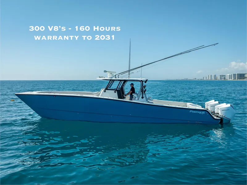 Slide: The Image of Blue 2019 Freeman 42 LR boat on ocean, 300 V8 engines, warranty until 2031. - 0