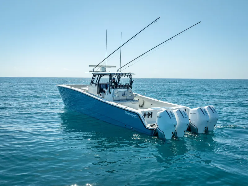 Slide: The Image of 2019 Freeman 42 LR boat on open sea with dual engines. - 1