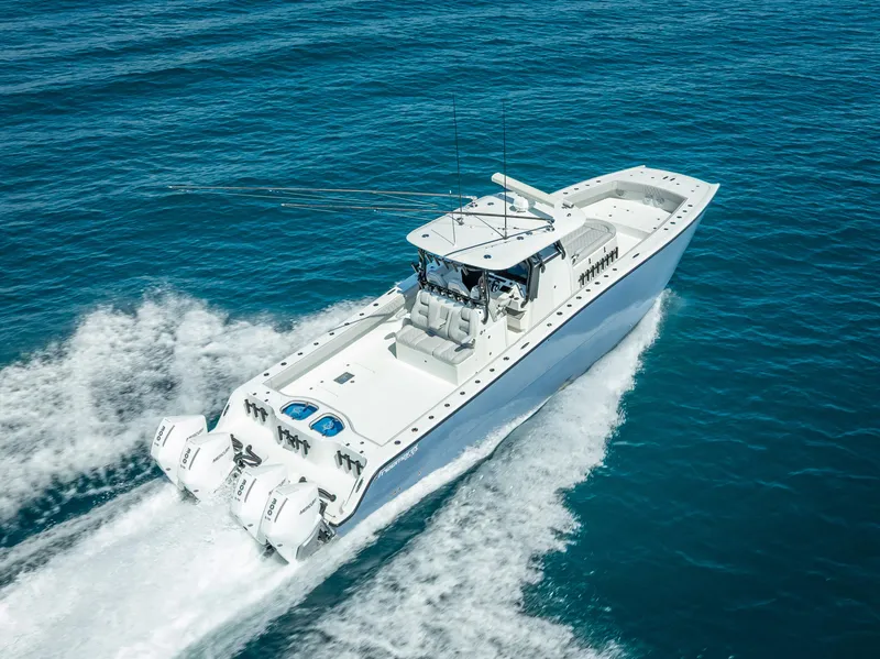Slide: The Image of 2019 Freeman 42 LR boat cruising on open blue water. - 10