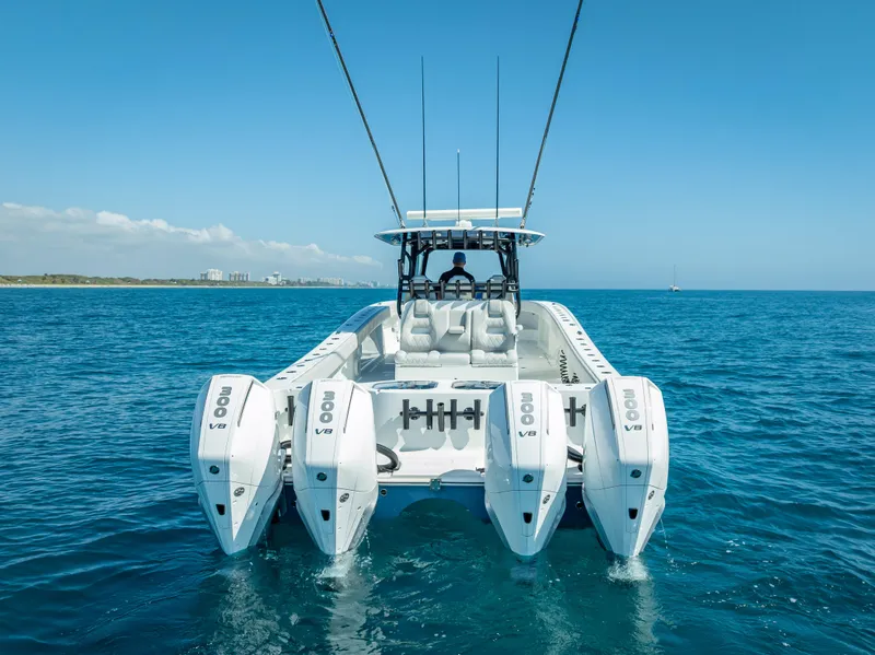 Slide: The Image of 2019 Freeman 42 LR boat with quad engines on open water. - 14