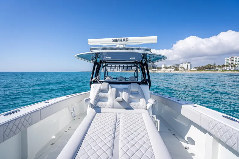 Slide: The Image of 2019 Freeman 42 LR boat on open sea with clear skies and coastal view. - 16