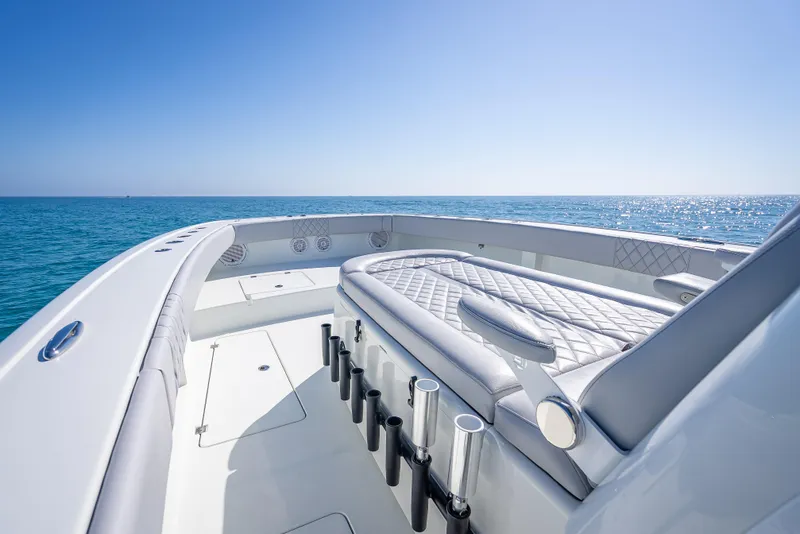 Slide: The Image of Luxurious 2019 Freeman 42 LR boat on calm ocean waters under clear blue sky. - 17