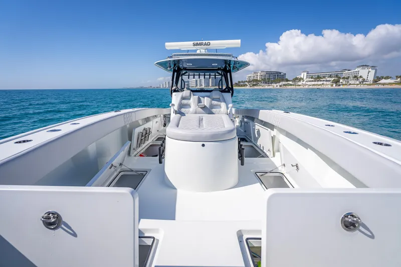Slide: The Image of 2019 Freeman 42 LR boat on clear blue ocean near coastline. - 20