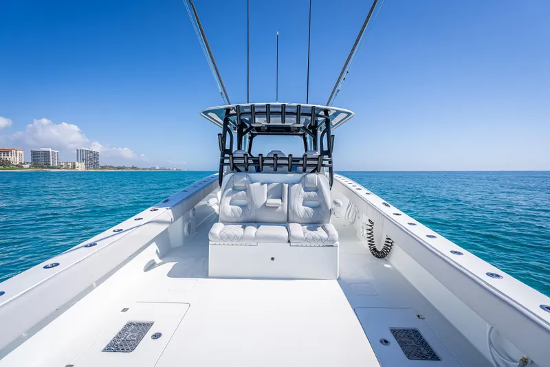 Slide: The Image of 2019 Freeman 42 LR boat on clear blue ocean near coastline. - 27