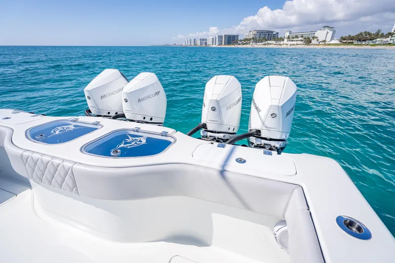 Slide: The Image of 2019 Freeman 42 LR boat with Mercury engines on clear blue ocean near coastline. - 35