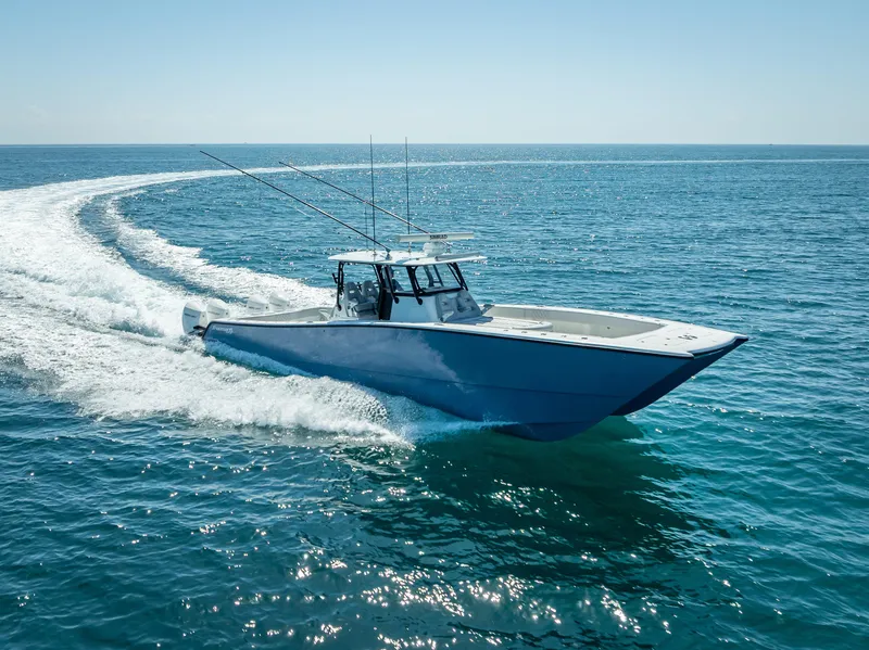Slide: The Image of 2019 Freeman 42 LR boat cruising on open ocean waters. - 4