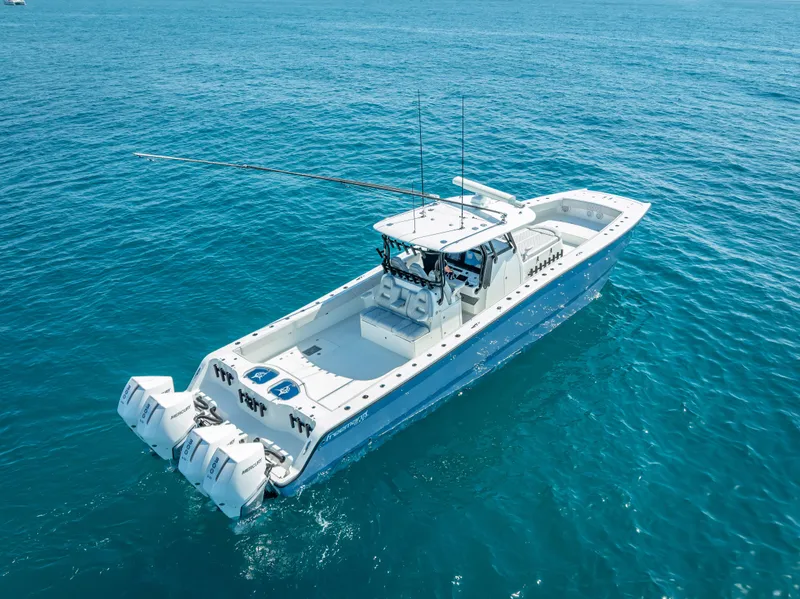 Slide: The Image of 2019 Freeman 42 LR boat cruising on clear blue ocean waters. - 5