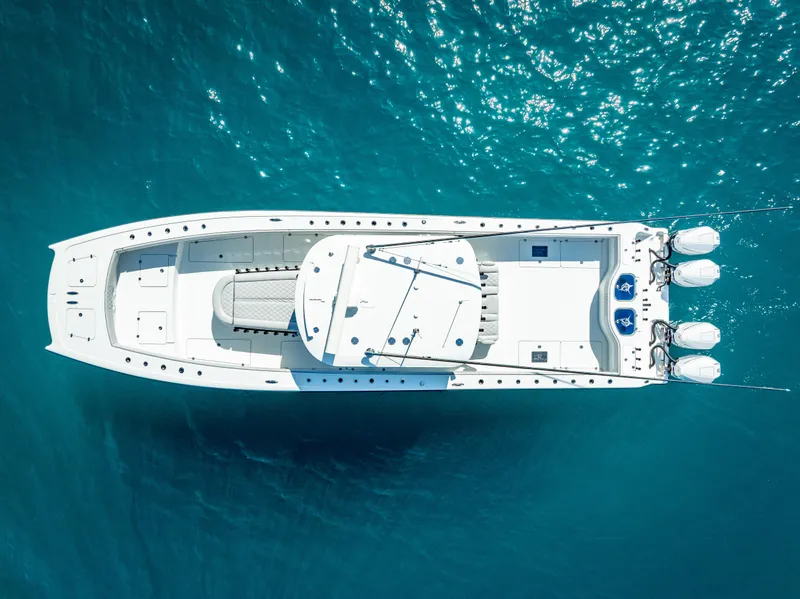 Slide: The Image of Aerial view of 2019 Freeman 42 LR boat on clear blue water. - 6