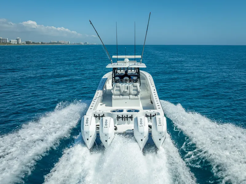 Slide: The Image of 2019 Freeman 42 LR boat cruising on open blue ocean with powerful engines. - 9