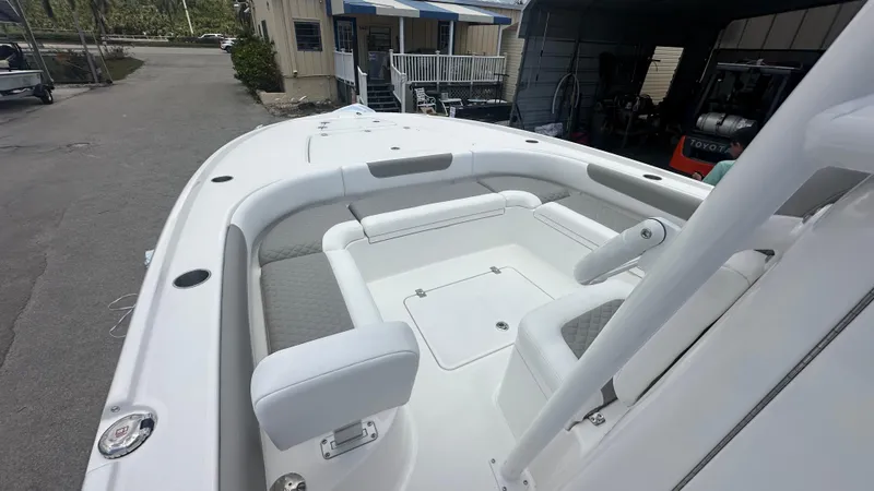 Slide: The Image of 2025 Caymas 26 HB boat with spacious seating and sleek design. - 6