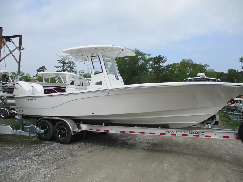 The Image of 2025 Sea Fox 282 Hybrid LT boat on trailer, side view, outdoors. - 1