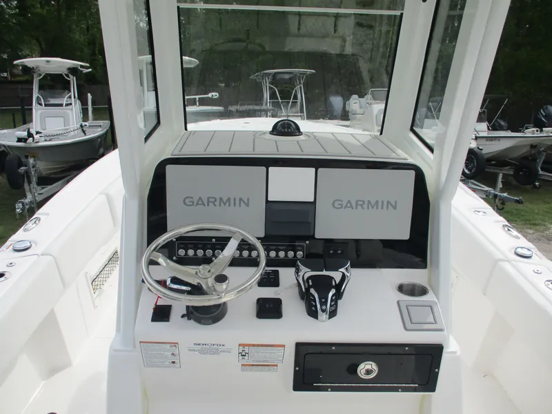 Slide: The Image of 2025 Sea Fox 282 Hybrid LT boat dashboard with Garmin navigation displays. - 8
