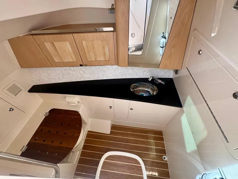 Slide: The Image of Luxurious 2025 Grady-White 345 boat interior with modern wood finishes and sleek design. - 12