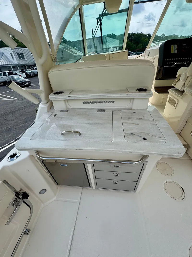 Slide: The Image of 2025 Grady-White 345 boat interior with storage and seating area. - 4