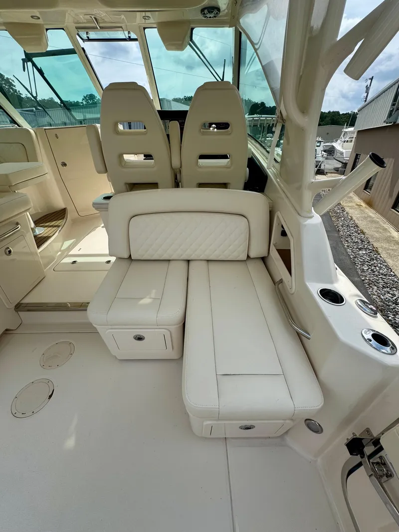 Slide: The Image of 2025 Grady-White 345 boat interior with plush seating and modern design. - 5