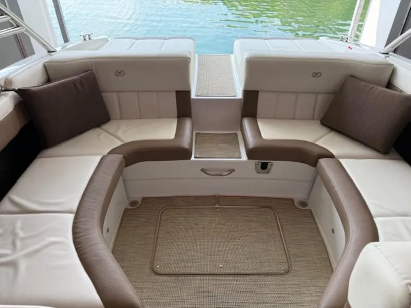 Slide: The Image of Luxurious seating area on a 2016 Cobalt 296 boat, featuring plush cushions and elegant design. - 12