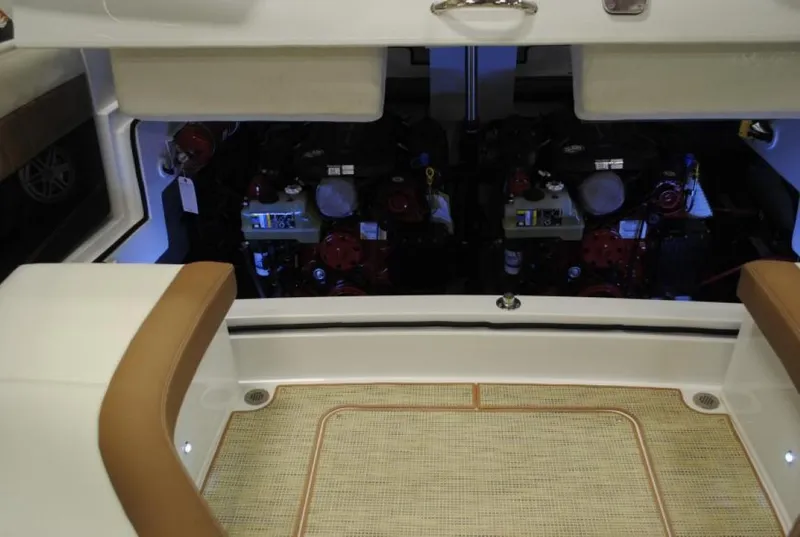 Slide: The Image of Interior view of a 2016 Cobalt 296 boat engine compartment with seating area. - 13