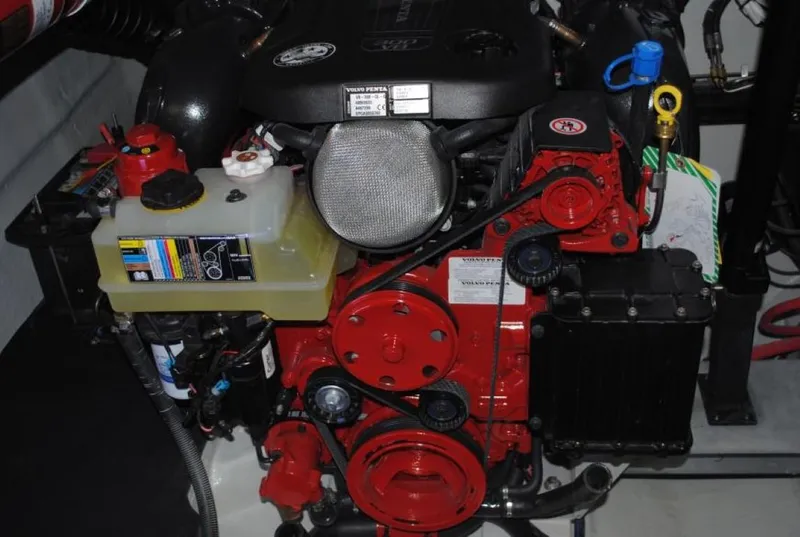 Slide: The Image of 2016 Cobalt 296 engine, featuring red components and fluid reservoirs. - 14